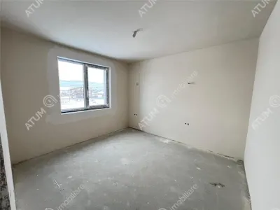 De vanzare apartament intabulat cu 3 camere decomandate 2 bai balcon si loc de parcare situat in Talmaciu/ Sibiu - foto 3
